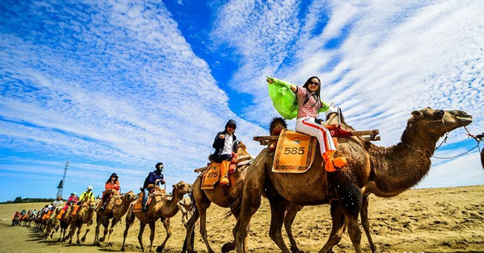 'Singing sand' attracts more tourists in Gansu