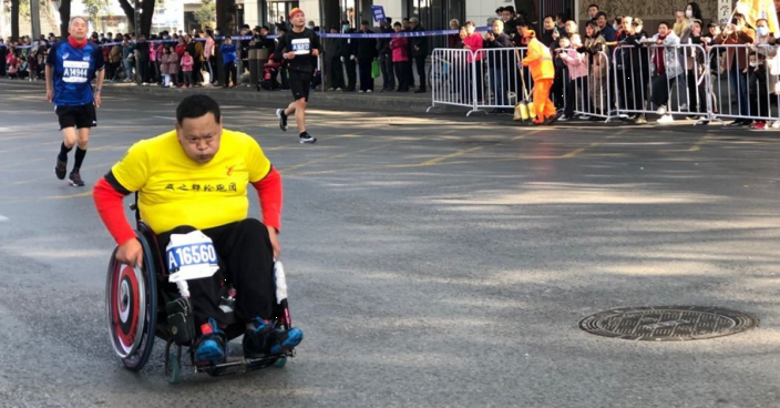 Profile: Wheelchair marathoner keeps shattering barriers in life