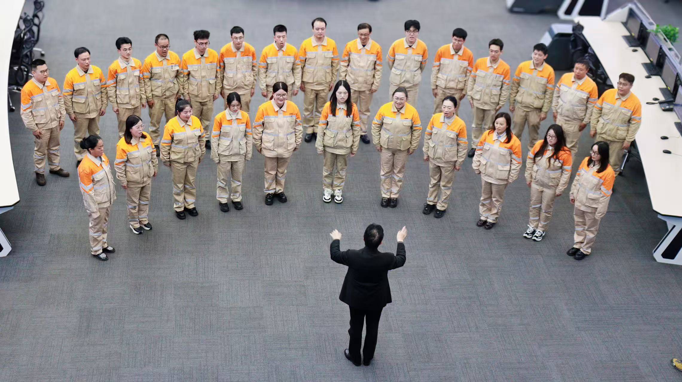 The Wuxi steel workers' choir performs, showcasing their passion for music. 
