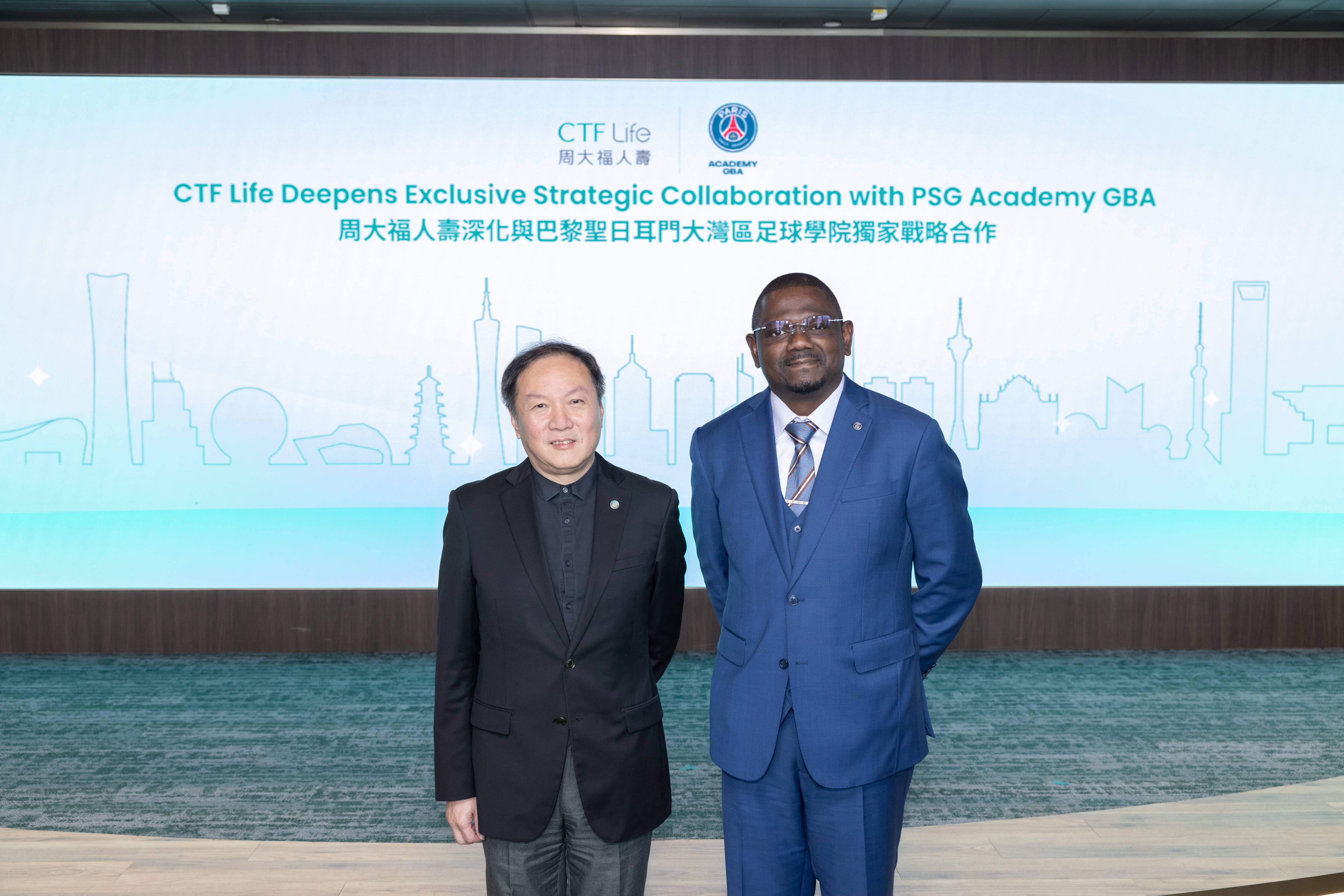 Man Kit Ip, Executive Director and Chief Executive Officer of CTF Life (left) and Yannick Ngassa, Chief Executive Officer of PSG Academy (GBA, China) (right) announce the extension of their exclusive collaboration to continue bringing Paris Saint-Germain Academy football training programmes and related sports initiatives to Hong Kong and all cities across the Chinese Mainland. 